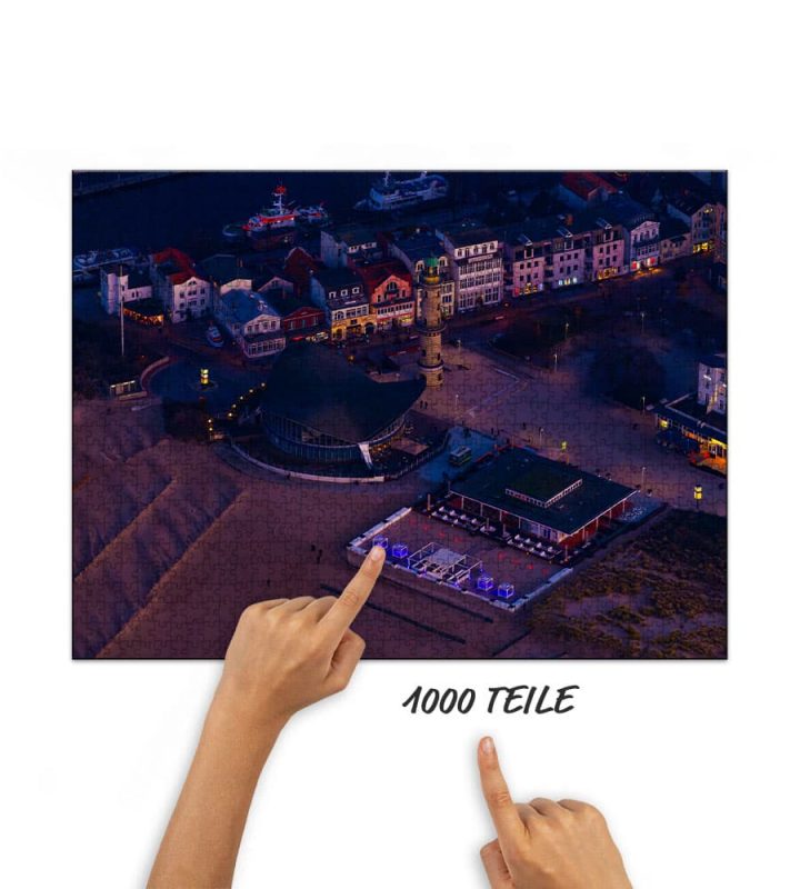 Puzzle Teepott und Leuchtturm im Abendlicht